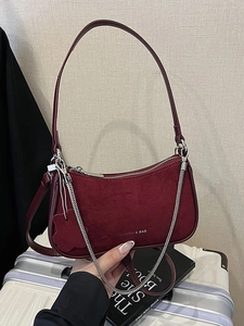 Vintage burgundy underarm bag with chain detail and suede texture for women's fashion