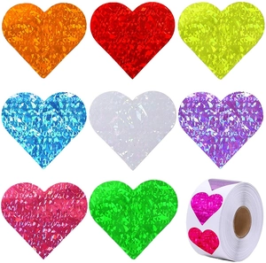 Macro shot of 8-color heart laser stickers with holographic glitter texture on white background
