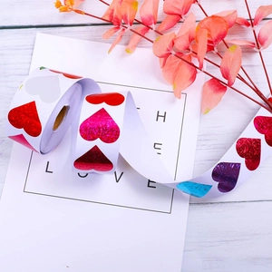 Roll of glitter heart stickers with colorful holographic patterns for gift decoration