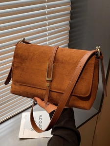 Retro caramel brown suede rectangular shoulder bag with golden buckle and sleek strap