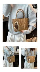 Detail of brown woven bucket bag with chocolate charm and adjustable strap options