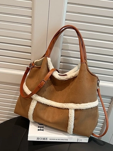 Large suede tote bag with faux shearling trim and brown leather straps for autumn fashion