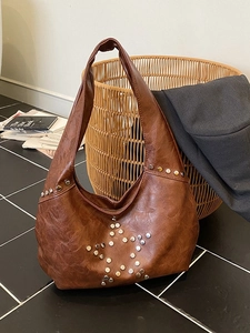 Vintage brown leather shoulder bag with silver rivet star pattern in hobo style