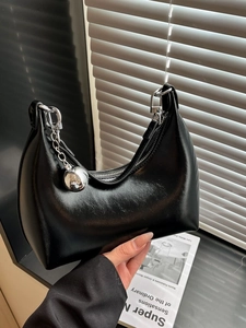 Minimalist black hobo shoulder bag with shiny faux leather and silver metal ball charm