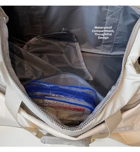 Interior detail showing waterproof wet/dry separation pocket in large travel bag