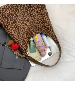 Close-up of leopard print tote bag interior showing large capacity for essentials