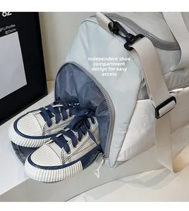 Close-up of a travel bag featuring a separate compartment for blue canvas shoes