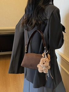 Retro brown suede shoulder bag with top handle and cute plush bear charm decoration