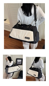 Detail of a large capacity travel bag showing mesh side pockets and adjustable shoulder strap