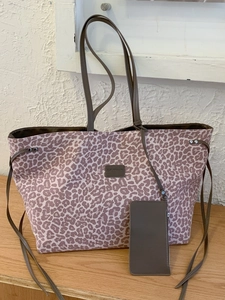 Pink leopard print tote bag with a matching small coin pouch and MyStudio brand tag