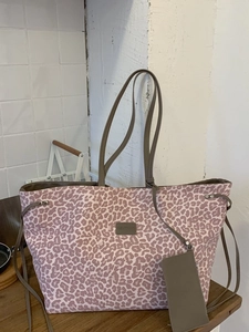 Pink leopard print canvas tote bag with long handles and matching mini pouch