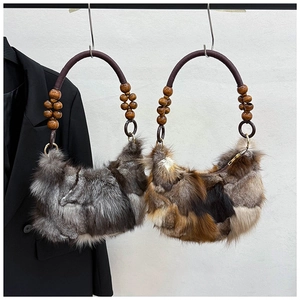 Detailed view of faux fur shoulder bags with retro wooden beads on round handles