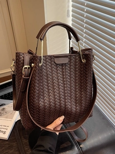 Retro coffee brown woven leather tote bag with elegant golden metal top handles