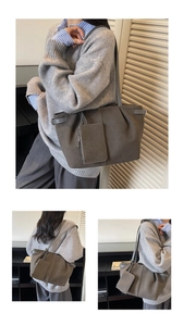 Detail view of the deep brown faux suede tote bag featuring silver buckles and a small pouch