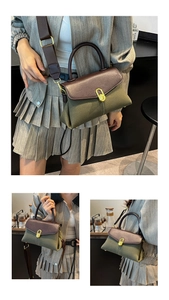 Detail of olive canvas and brown leather crossbody bag with golden oval twist lock