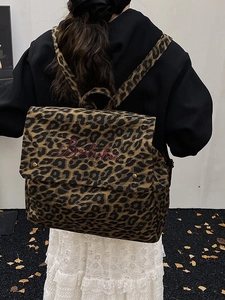 Fashionable leopard print canvas backpack with large capacity and red embroidery detail