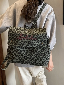 Stylish leopard print canvas backpack for travel with red embroidery and flap closure
