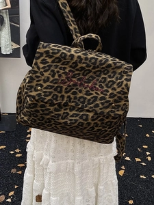 Stylish leopard print canvas backpack with flap design and red letter embroidery