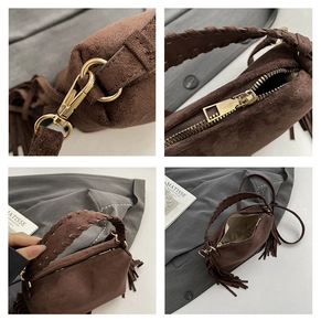 Detail of dark brown suede handbag with long tassels and woven handle hardware