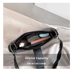 Internal capacity of crocodile pattern shoulder bag showing space for cosmetics and essentials