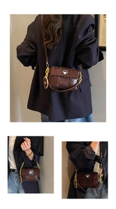 Close-up of brown woven square bag with cartoon sheep emblem and golden chain strap