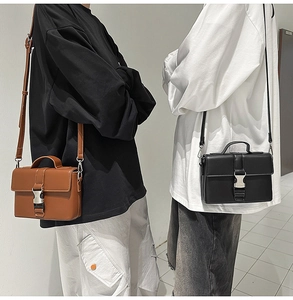 Detail of minimalist PU leather crossbody bags with silver metal buckle in brown and black