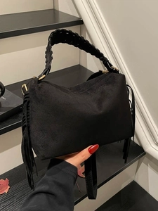 Large black suede hobo bag with fringe details and woven handle for casual autumn wear