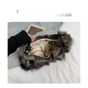 Top view of plush shoulder bag interior with ample space for phone and cosmetics