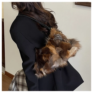 Fashionable long faux fur shoulder bag with multicolor patchwork and slim leather strap