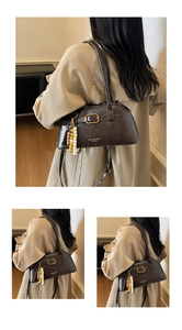 Close-up of vintage brown shoulder bag with gold square buckle and beaded fringe tassel