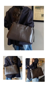 Detail showing high-quality leather texture and metallic logo on a brown tote bag