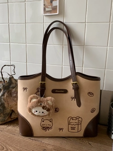 Elegante borsa tote beige e marrone con stampe di cartoni animati e ciondolo a orsetto