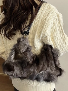 Chic fuzzy grey faux fur shoulder bag with black knotted strap and gold hardware