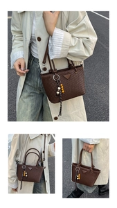 Detailed view of brown quilted bucket bag featuring a triangle logo and beaded charm