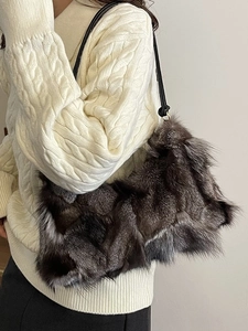 Stylish faux fur shoulder bag for women with patchwork design and black leather straps