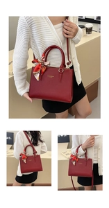 Detail of red lychee pattern bridal handbag with gold logo and silk scarf handle decor