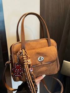 Brown faux suede bowling bag with silver twist lock and decorative bear charms