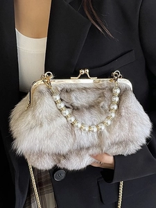 Elegant fox fur crossbody bag in taupe with pearl handle and gold chain strap