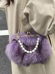 Purple faux fox fur crossbody bag with gold chain and pearl handle for autumn style