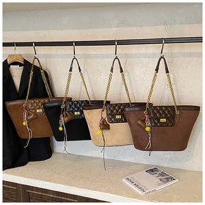 Quilted tote bags in dark brown and black colors with chain straps and emoji charms