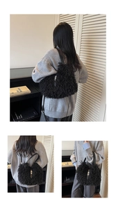 Detail view of plush faux fur shoulder bag with silver twist lock and leather strap