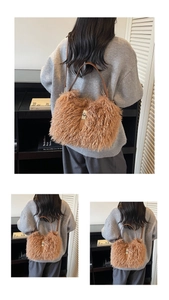 Back view of plush brown faux fur shoulder bag with leather strap on a model