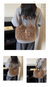 Detail of plush brown faux shearling bucket bag with leather strap and metal clasp