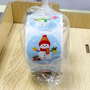 Detail of Christmas cartoon roll stickers featuring snowman and gift box in plastic wrap