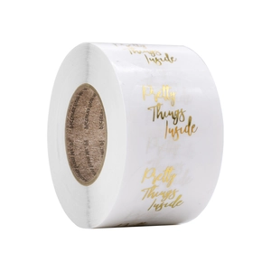 Roll of 1 inch white stickers with gold foil Pretty Things Inside script for baking