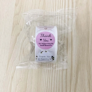 Detail of round Thank You stickers on a roll for small business packaging and gift sealing