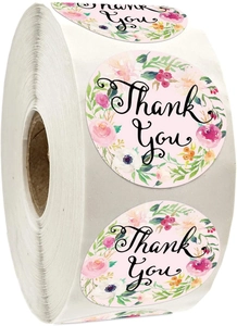 Detailed close-up of pink floral thank you stickers in a large roll for packaging