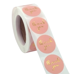 Roll of 500 pink round thank you stickers with gold foil lettering for gift packaging