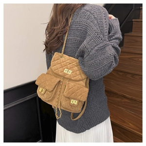 Brown quilted suede mini backpack with gold chain straps and rotating metal locks