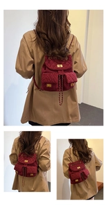 Detail of burgundy quilted velvet mini backpack with gold chain straps and twist locks